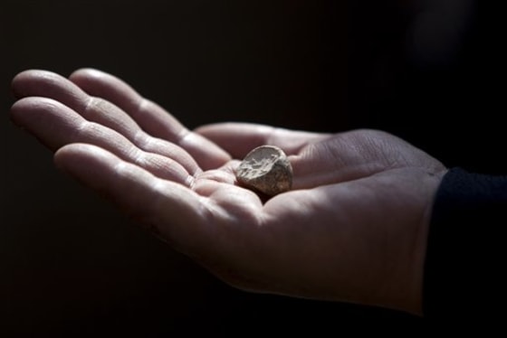 A rare clay seal is displayed during a news conference at the archaeological site known as the City of David in east Jerusalem on Sunday.
